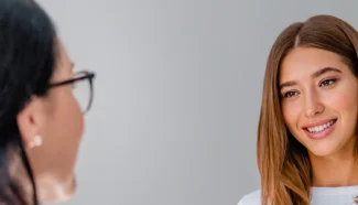 A woman talking to her doctor wondering if egg donation hurts.