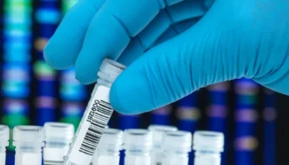 Lab technician doing expanded genetic testing.
