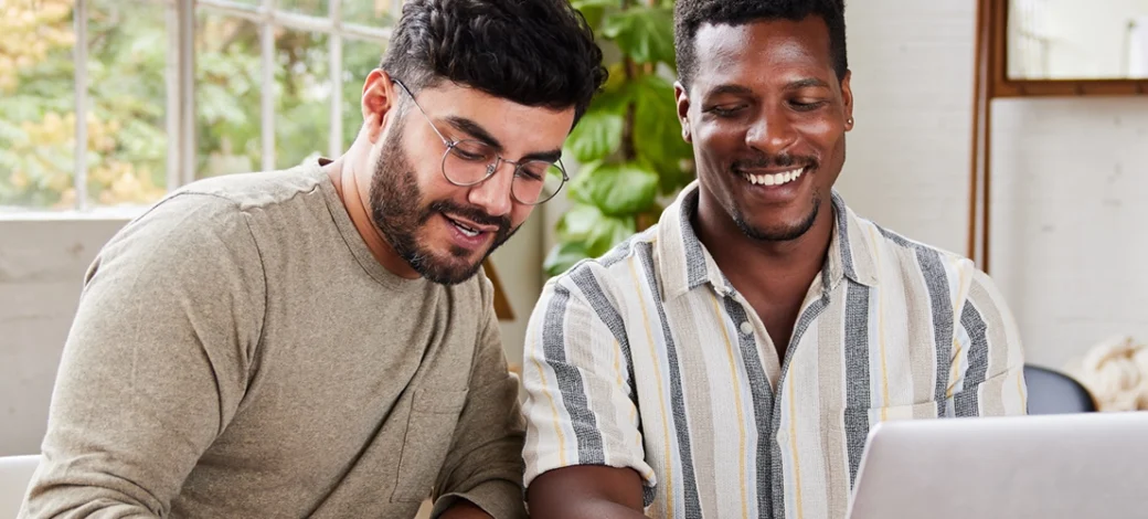 Same sex male couple looking at Fairfax EggBank's 4 tips for choosing an egg donor.