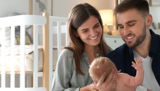 Donor egg recipients looking down at their egg donor conceived baby after using Genpanel+.