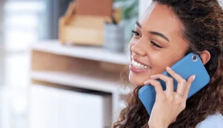 Donor egg recipient on the phone with her client relations specialist to secure her donor eggs.
