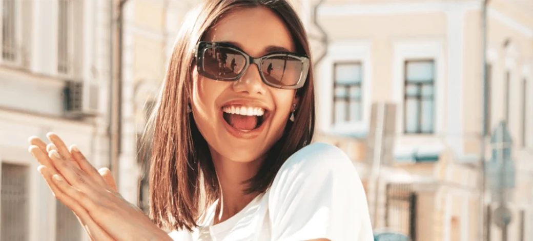 A smiling woman that is happy she's a travel egg donor.