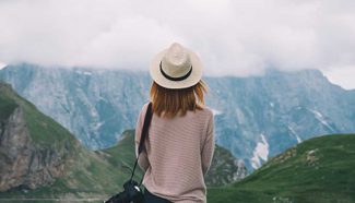 woman looks at mountains