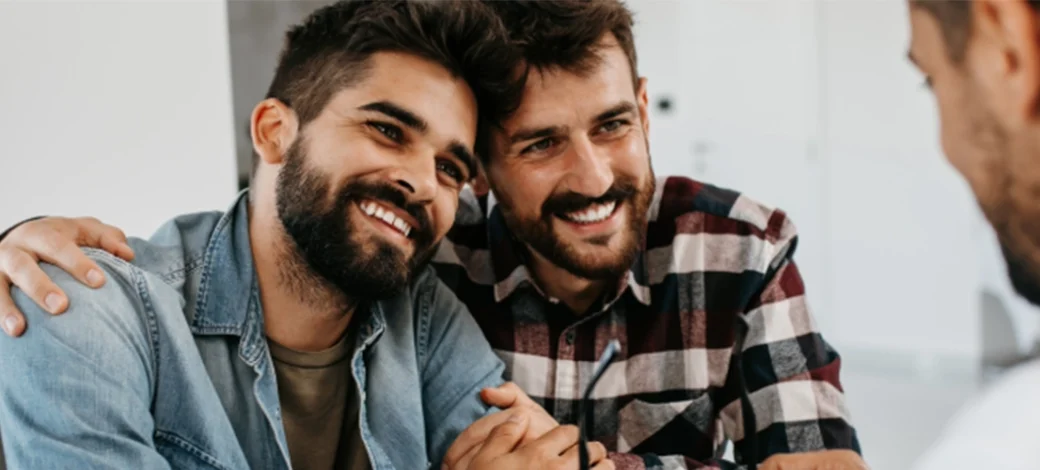 Same sex male couple speak to their doctor about fertility tips for LGBTQ families.