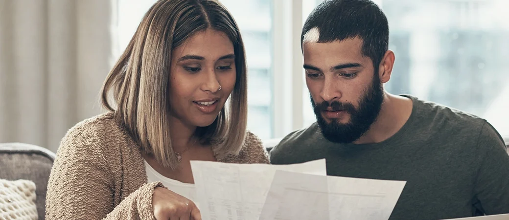 A couple looking at their finances for their IVF treatment.