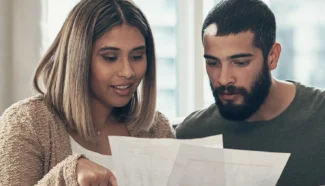 A couple looking at their finances for their IVF treatment.
