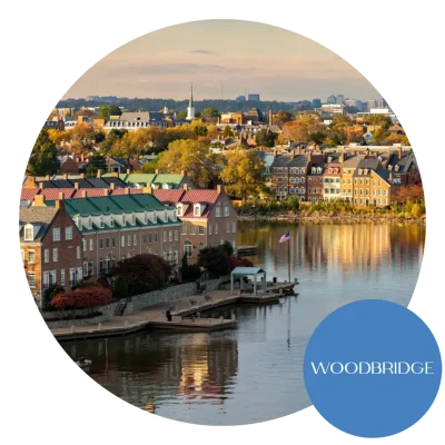 A view of the waterfront in Woodbridge and Alexandria, VA with a pier and waterfront homes in the foreground. Become an egg donor in Virginia today!